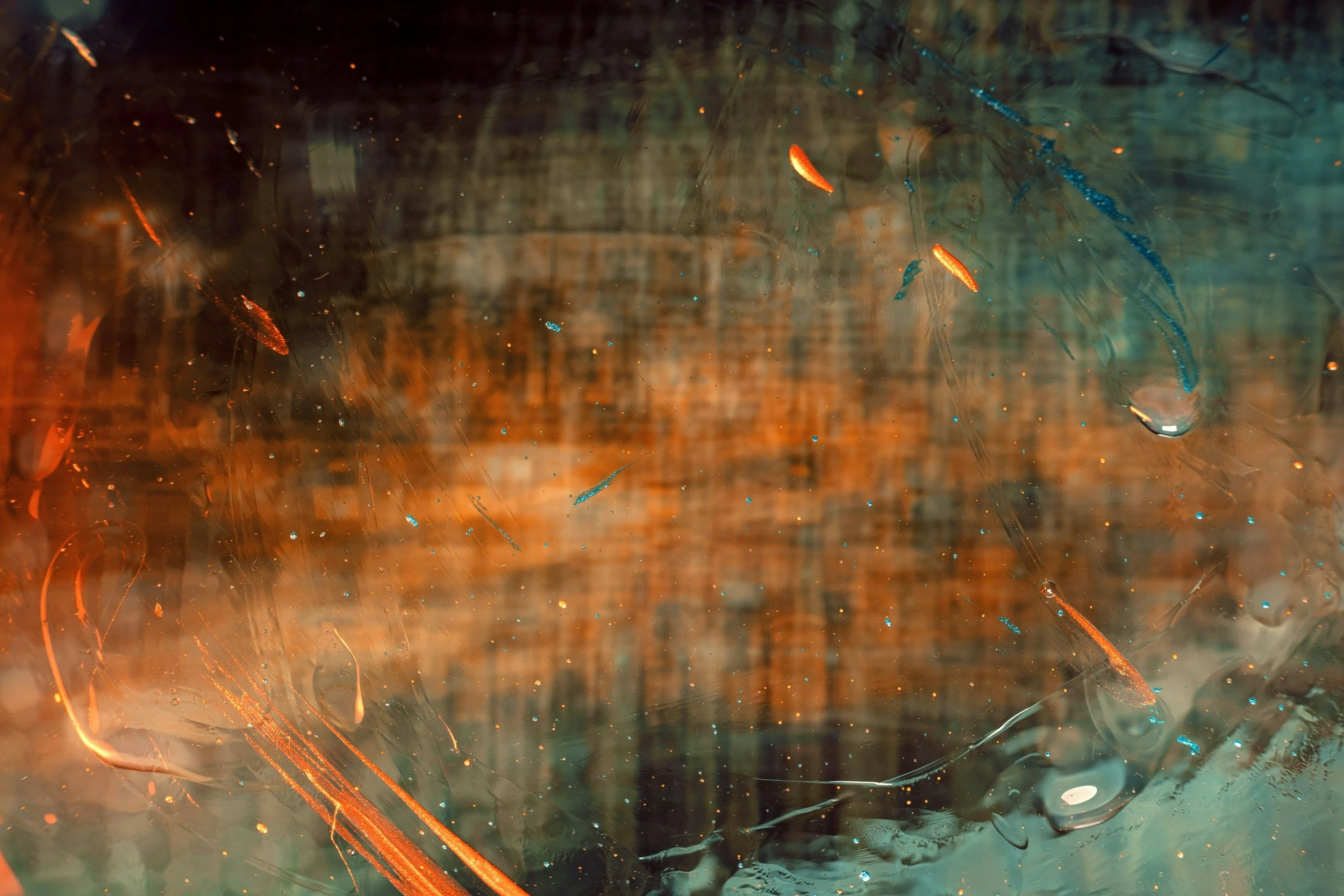 Abstract layered textures in teal, bronze and amber.