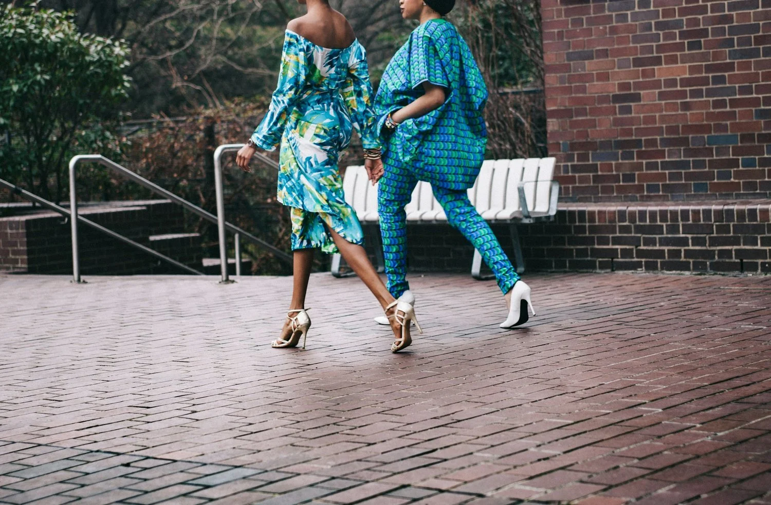 Two people wearing coordinated blue patterned fashion.